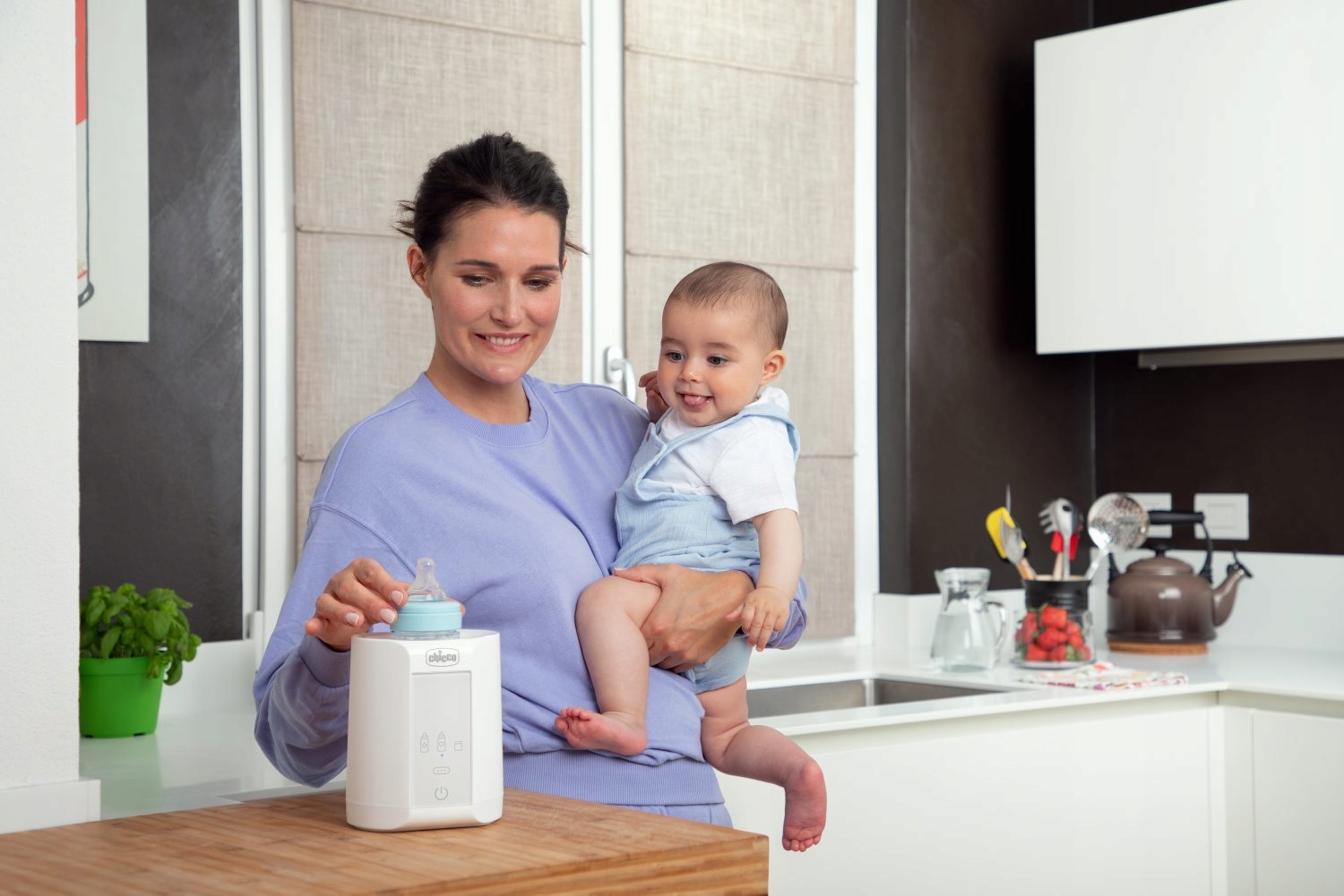 Detail ovládacího tlačítka ohřívače Chicco s výkonem 220W